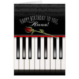 birthday red rose on piano keyboard with name