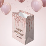 Birthday rose gold glitter drips monogram luxury medium gift bag<br><div class="desc">A gift bag for a girly and glamourous 21st (or any age) birthday. A rose gold background with rose gold and pink faux glitter drips, paint dripping look. The text: The name is written in dark rose gold with a modern hand lettered style script. The text: Happy Birthday is written...</div>