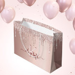 Birthday rose gold glitter pink monogram script large gift bag<br><div class="desc">A gift bag for a girly and glamourous birthday. A faux rose gold background with elegant pink and rose gold glitter drips, paint dripping look. Personalise and add a name and monogram letter. The name is written in burgundy with a modern hand lettered style script with swashes. To keep the...</div>