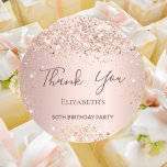 Birthday rose gold thank you classic round sticker<br><div class="desc">For a girly and glamourous 50th (or any age) birthday party.  A rose gold background. Personalise and add a name and age 50. With the text: Thank You written with a modern hand lettered style script.</div>