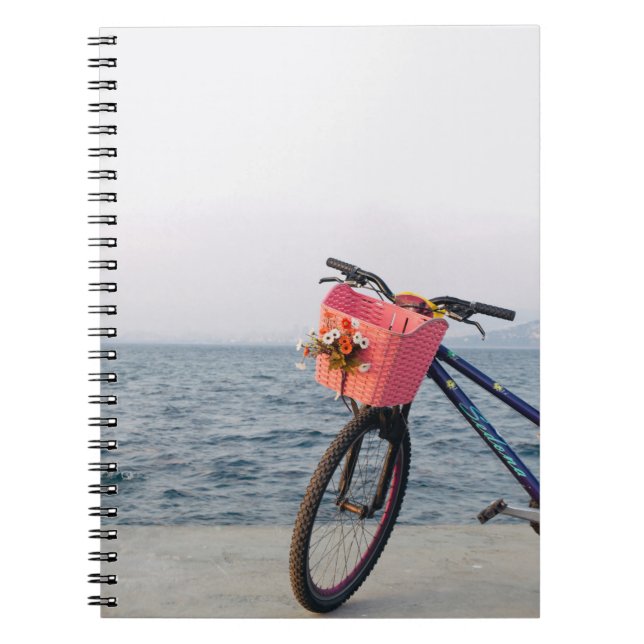 Black and blue bicycle with basket notebook (Front)