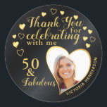 Black and Gold 50th Birthday Party Thank You Classic Round Sticker<br><div class="desc">Create unique black and gold Thank You stickers for 50 and Fabulous 50th birthday party favours. Design features a photo in a heart shape, the name, and the fiftieth milestone and saying Thank you for celebrating with me. Templates make it easy to upload a photo and type your name. On...</div>