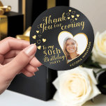 Black and Gold 50th Birthday Thank You Favour Classic Round Sticker<br><div class="desc">Create unique black and gold Thank You stickers for the 50th birthday party favours with an elegant design that features a photo in a heart shape, the name, and the fiftieth milestone. Use the template to type your text and upload a picture. On this design, black background imitates metallic surface....</div>