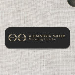 Black and Gold Logo Name Tag Modern Typography<br><div class="desc">Make a statement with this black and gold logo name tag featuring a modern and sleek design. The left side showcases a customisable black and gold logo, while the right side displays the name and title in a clean sans serif font. Perfect for corporate events, conferences, and networking occasions, this...</div>