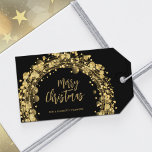 Black and Gold Merry Christmas Gift Tags<br><div class="desc">Merry Christmas in chic lettering is surrounded by gold circles,  stars and dots on a black background on these holiday party favour gift tags. Personalise with your names at the bottom. MATCHING items in our store.</div>