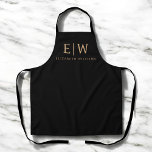 Black and Gold Minimalist Modern Monogram Apron<br><div class="desc">Cook, create, or craft in style with this Black and Gold Minimalist Modern Monogram Apron. Featuring a sleek black fabric and a bold faux gold monogram, this apron combines everyday function with elevated design. Perfect for chefs, bakers, artists, or anyone who loves a personalised touch, it includes adjustable straps and...</div>