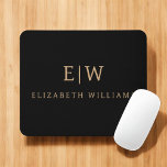 Black and Gold Minimalist Modern Monogram Mouse Mat<br><div class="desc">Elevate your desk setup with this Black and Gold Minimalist Modern Monogram Mouse Pad. Featuring a sleek black background and bold faux gold monogram, this design combines contemporary style with personalised flair. Perfect for professionals, students, or anyone who appreciates elegant desk accessories, this mouse pad adds a refined touch to...</div>