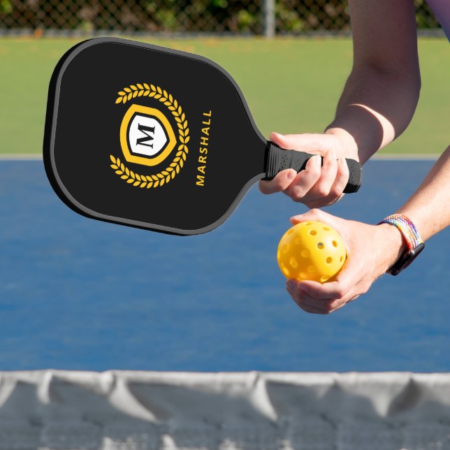 Black and Gold Monogram Logo Crest Pickleball Paddle (Insitu)
