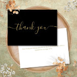 Black And Gold Simple Modern Elegant Script Thank You Card<br><div class="desc">Simple modern elegant gold script on a black background thank you card. You can personalise with your own thank you message on the reverse or if you would prefer to add your own handwritten message simply delete the text. A perfect way to say thank you! Designed by Thisisnotme©</div>