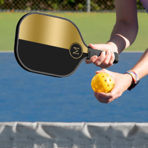 Black and gold split-screen geometric design pickleball paddle