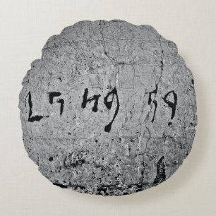 Black and grey concrete surface round cushion