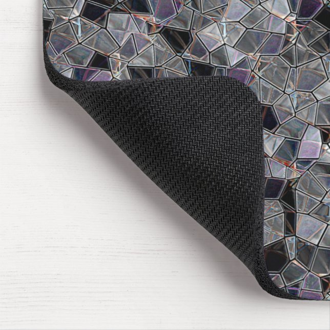 Black and grey mosaic with partially removed colou mouse mat (Corner)