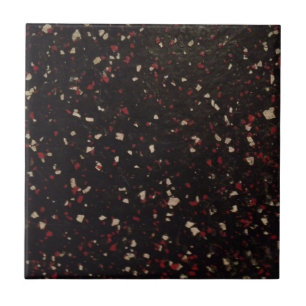 black and red and white speckled pattern tile