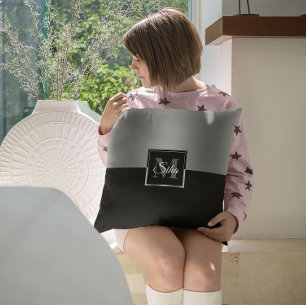 Black and silver split-screen geometric design cushion