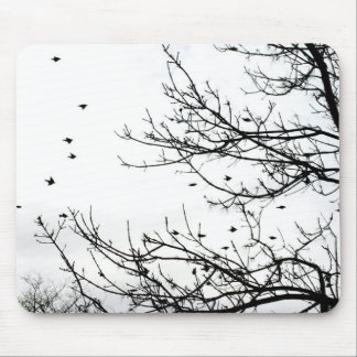 Black and White Birds Flying Off Trees Mousepad