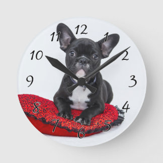 Black and White Bulldog Terrier on Red Pillow Round Clock