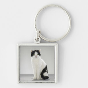 Black and white cat with glowing green eyes key ring