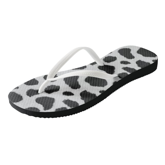 Black and white cow spots pattern fur texture flip flops (Angled)