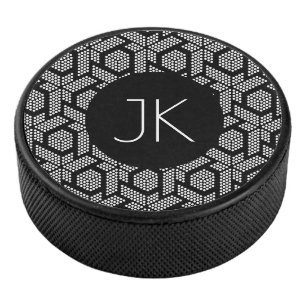 Black and white dotted geometric shapes pattern hockey puck