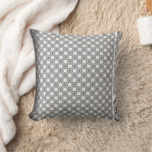 Black and white fabric design featuring intricate  cushion