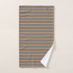 Black and white five stripe pattern with tan hand towel