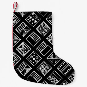 Black and white geometrical background with hand d small christmas stocking