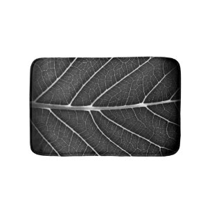 Black and white glowing leaf close-up bath mat