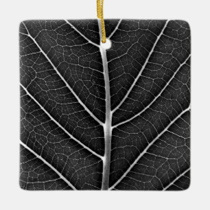 Black and white glowing leaf close-up ceramic ornament