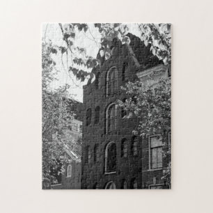 Black and white historical building in Amsterdam Jigsaw Puzzle