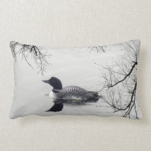 Black and white loon on a lake decor pillow