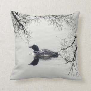 Black and white loon on a lake decor pillow