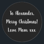 Black and White Merry Christmas from Mum gift tag<br><div class="desc">Black and White Christmas gift tag sticker with the message Merry Christmas Love Mum xxx in white typography/ script. Simply change the name Alexander to your loved one in the personalise this text box. Want to make more changes? All of the text can be personalised here as well. Or if...</div>