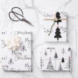 Black and White Merry Christmas Tree Wrapping Paper Sheet<br><div class="desc">Beautiful and elegant black and white Merry Christmas wrapping paper set is perfect for those who like a simple and minimalist aesthetic. The  Christmas trees have a tiny gold star. So pretty with the hand written script typography.</div>
