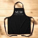Black and White Minimalist Modern Monogram Apron<br><div class="desc">Introducing our Black and White Minimalist Modern Monogram Collection: Embrace simplicity and sophistication with our minimalist designs, curated to elevate your style effortlessly. Crafted with a keen eye for modern aesthetics, this collection features sleek black and white designs accentuated by personalised monograms. From chic stationery to versatile accessories, our collection...</div>