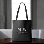 Black and White Minimalist Modern Monogram Tote Bag<br><div class="desc">Introducing our Black and White Minimalist Modern Monogram Collection: Embrace simplicity and sophistication with our minimalist designs, curated to elevate your style effortlessly. Crafted with a keen eye for modern aesthetics, this collection features sleek black and white designs accentuated by personalised monograms. From chic stationery to versatile accessories, our collection...</div>