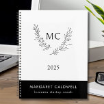 Black and White Monogram Wreath 2025 Planner<br><div class="desc">Black and White Monogram Wreath Annual Planner... The front of our classic black and white planner displays a business logo of an elegant botanical wreath bordering your two monogram initials in black ink... all on a white background. Your name and title (or company name) appear in white ink on a...</div>