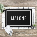 Black and White Personalised Family Name Doormat<br><div class="desc">Modern minimalist doormat personalised with your family last name monogram or other custom text. Click the Customise It button to choose any background colour,  change fonts,  add your own text and photos to match your unique style.</div>