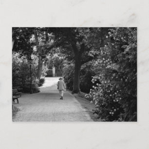 Black and white photo of old man at park postcard