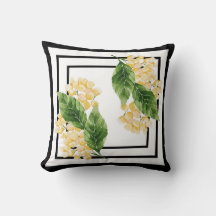 Black and white pillow with yellow flowers