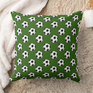 Black and White Soccer Balls on Green Cushion