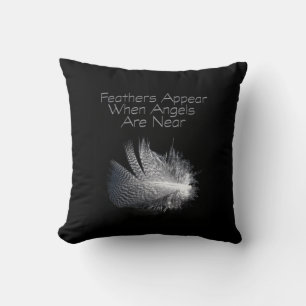Black and White Striped Feather Floating on a Pond Cushion