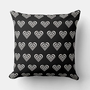 Black and white striped heart on black cushion