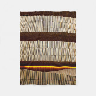 Black and white striped textile fleece blanket