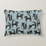Black and White Tuxedo Cats Decorative Cushion<br><div class="desc">Cute black and white tuxedo cats going about their business. A fun pattern on a mid blue background.</div>