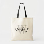 Black and white WIFEY monogram wedding tote bags<br><div class="desc">Black and white WIFEY monogram wedding tote bags. Classy budget totebag with stylish calligraphy typography. Cute wedding party accessory for new wife, bride to be, newlywed women and just married girls etc. Can also be use as personalizable bridesmaid tote bags for team bride. Make your own for bridesmaids, flower girl,...</div>