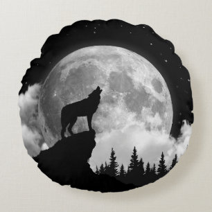 Black and white wolf howling at the moon round cushion
