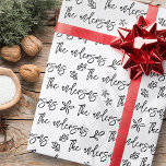 Black and White Your Family Name Christmas Pattern Wrapping Paper<br><div class="desc">This simple and modern design is composed of playful script typography.</div>