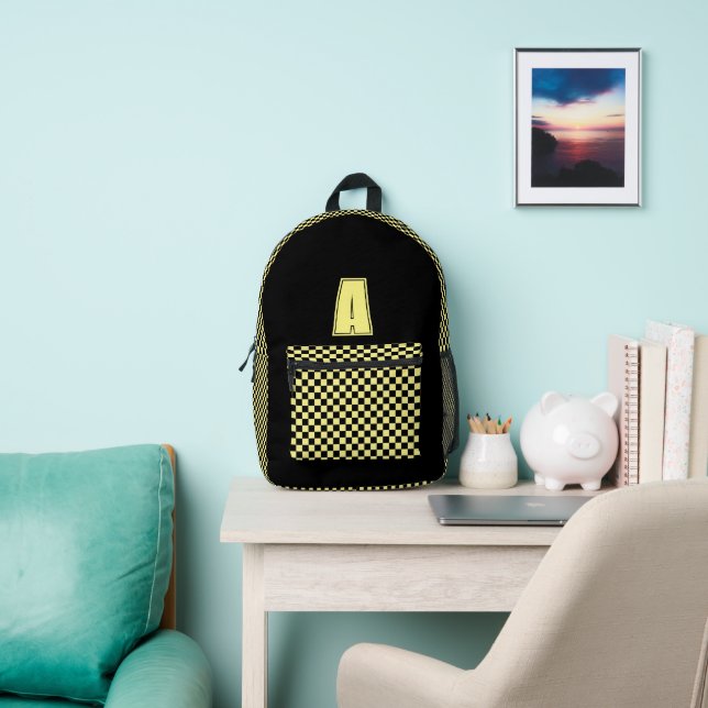 Black and yellow chequerboard monogram printed backpack (Insitu)