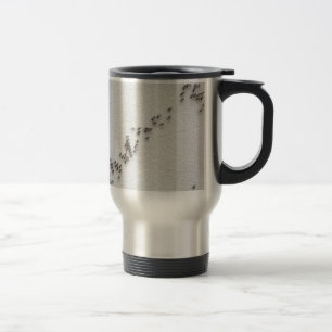 Black ants are following each other in a chain travel mug