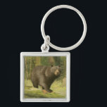 Black Bear Stepping on a Tree Trunk Key Ring<br><div class="desc">This fine art print by Oliver Kemp illustrates a brown bear stepping on a fallen tree in a forest. The pastel green colours are calming for the eye and create a nice warm feeling of the awakening nature in the spring. A great addition to any rustic home decor!</div>